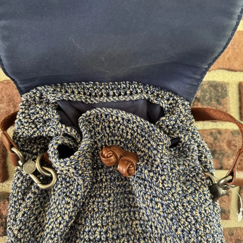 The Sak Brown & Navy Woven Backpack with Tassel Fringe and Embroidered Strap